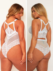 White lace lingerie set worn by a model on a plain background