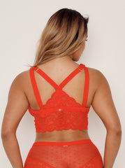 Red lace lingerie set on a plain background
