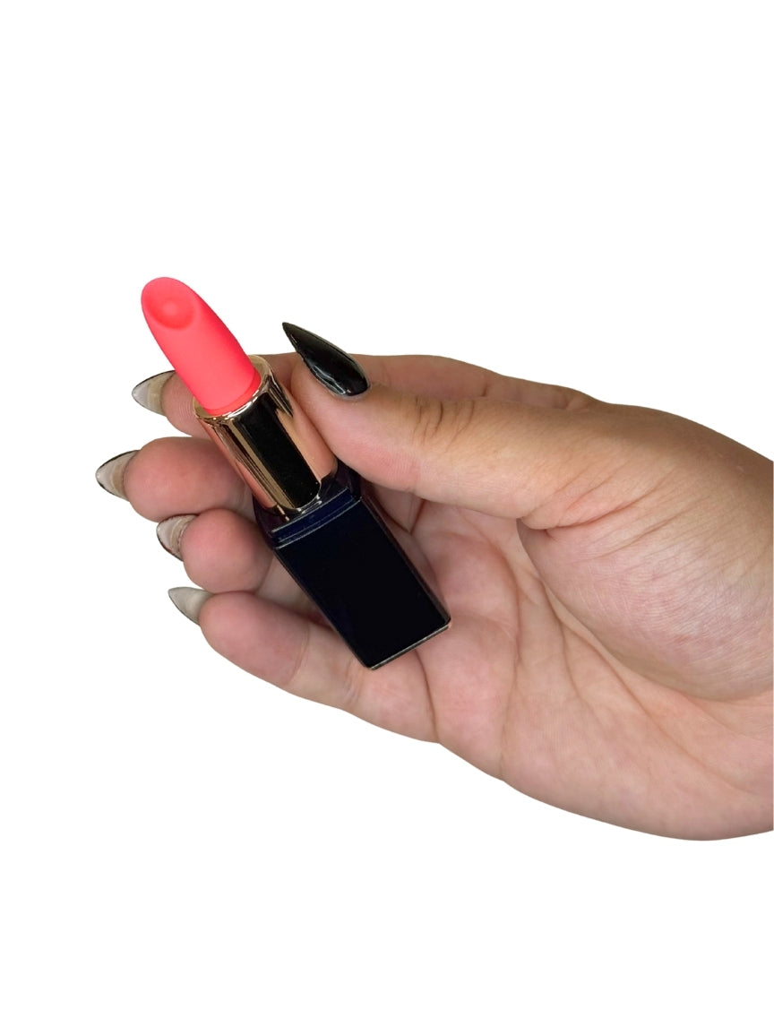 Hand holding a pink lipstick against a white background