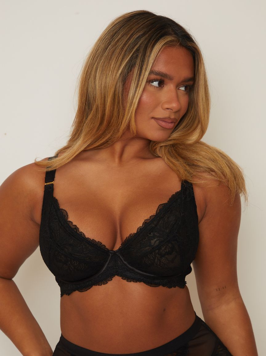 woman wearing a Tutti Rouge lace plunge bra in midnight black